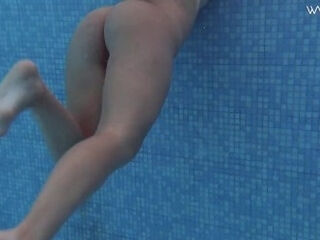'Brunette Spanish Diana Rius swimming topless'
