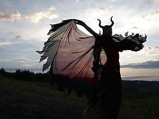 Maleficent on sunset sky
